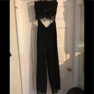 Black strapless body suit.